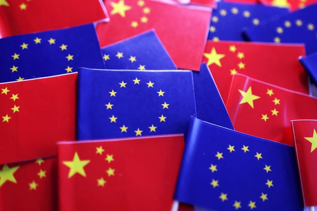 EU and Chinese flags are seen in this illustration taken, March 20, 2025. REUTERS/Dado Ruvic/Illustration