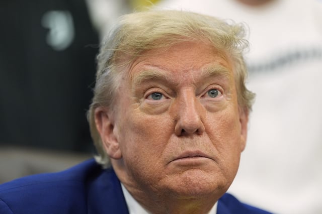 President Donald Trump talks with reporters as he meets with members of the Juventus soccer club in the Oval Office of the White House, Wednesday, June 18, 2025, in Washington.