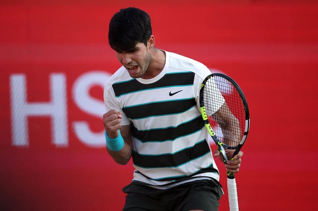 Carlos Alcaraz reacts against Jaume Munar during their men's singles round of 16 tennis match at the HSBC ATP tennis Championships at Queen's Club in west London on June 19, 2025.
