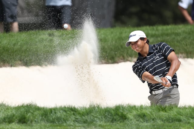 Charlie Woods of the United States plays a bunker shot on the 17th hole on day one of the 76th U.S. Junior Amateur Championship on the North Course at Oakland Hills Country Club on July 22, 2024 in Bloomfield Hills, Michigan.