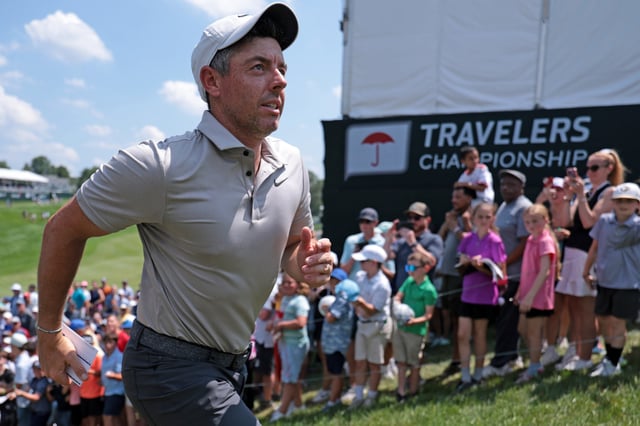 Rory McIlroy of Northern Ireland runs up the hill after his round on the 18th hole during the first round of the Travelers Championship 2025 at TPC River Highlands on June 19, 2025 in Cromwell, Connecticut.