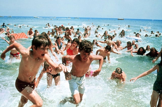 Amity Islanders flee the shark-infested water in this scene from "Jaws," shortly before little Alex Kintner's deflated raft returns to shore without him.