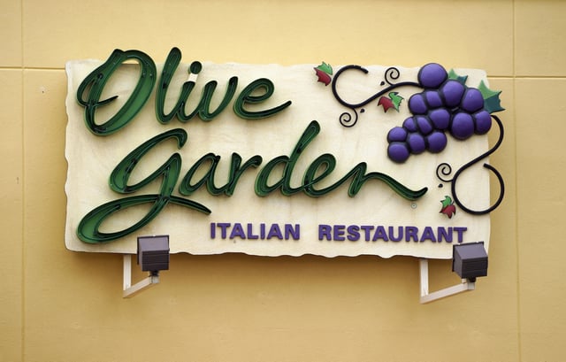 The sign outside the Olive Garden restaurant is seen in Westminster, Colorado March 19, 2015. Darden Restaurants Inc, the parent of Olive Garden will report earnings on March 20. REUTERS/Rick Wilking/File Photo