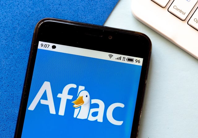 In this photo illustration an Aflac logo is seen displayed on a smartphone.