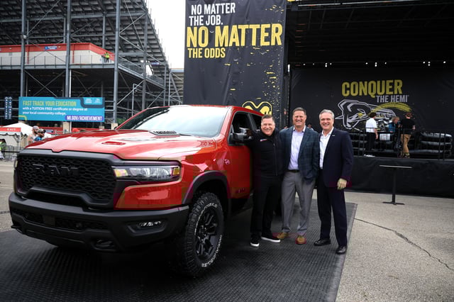 (L-R) Tim Kuniskis, CEO Ram Brand - Stellantis, NASCAR Executive Vice President Steve O&#39;Donnell and John Probst, SVP of Innovation and Racing Development pose at the Ram display on the midway for the announcement that the Ram brand will return to NASCAR Craftsman Truck Series competition, prior to the NASCAR Cup Series FireKeepers Casino 400 at Michigan International Speedway on June 08, 2025 in Brooklyn, Michigan.