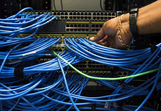 Canada’s telecommunications regulator has once again determined the country’s largest internet providers should be able to provide service to customers using fibre networks built by their rivals — as long as they are outside their core serving regions. Networking cables in a server bay are shown in Toronto on Wednesday, November 8, 2017. THE CANADIAN PRESS/Nathan Denette