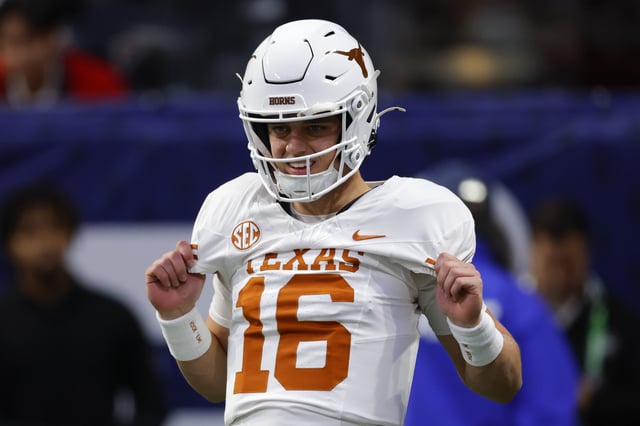 Arch Manning #16 of the Texas Longhorns warms up prior to the game against the Georgia Bulldogs in the 2024 SEC Championship at Mercedes-Benz Stadium on December 7, 2024 in Atlanta, Georgia.