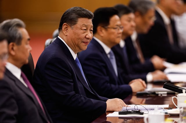 Chinese President Xi Jinping (2nd-L) attends a meeting with Brazil&#39;s President Luiz Inacio Lula da Silva (not pictured) at the Great Hall of the People in Beijing on May 13, 2025.