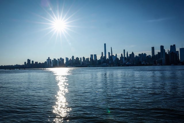 The sun rises over the New York skyline Friday as seen from Weehawken N.J.