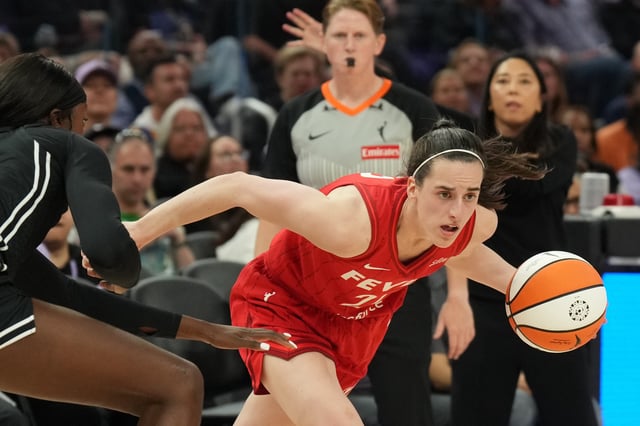 Jun 19, 2025; San Francisco, California, USA; Indiana Fever guard Caitlin Clark (right) dribbles against Golden State Valkyries forward Laeticia Amihere (left) during the third quarter at Chase Center. Mandatory Credit: Darren Yamashita-Imagn Images/File Photo