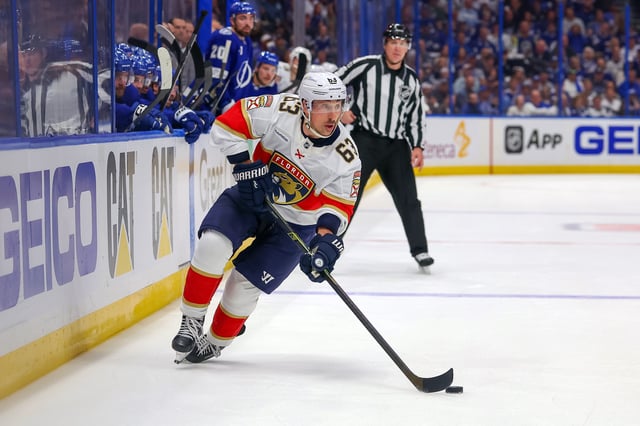 Brad Marchand #63 of the Florida Panthers looks to pass against the Tampa Bay Lightning in the first period of Game One of the First Round of the 2025 Stanley Cup Playoffs at the Amalie Arena on April 22, 2025 in Tampa, Florida.