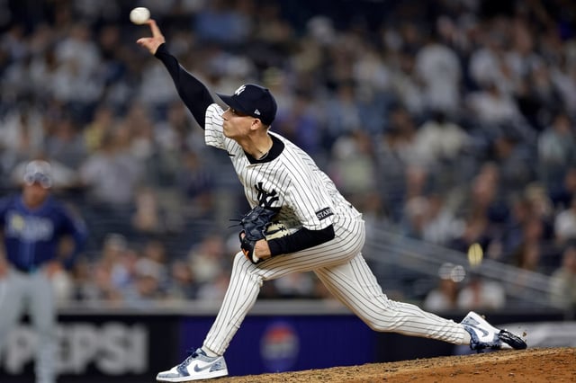 New York Yankees pitcher Luke Weaver (30) throws during the ninth inning of a baseball game against the Tampa Bay Rays Friday, May 2, 2025, in New York. (AP Photo/Adam Hunger)