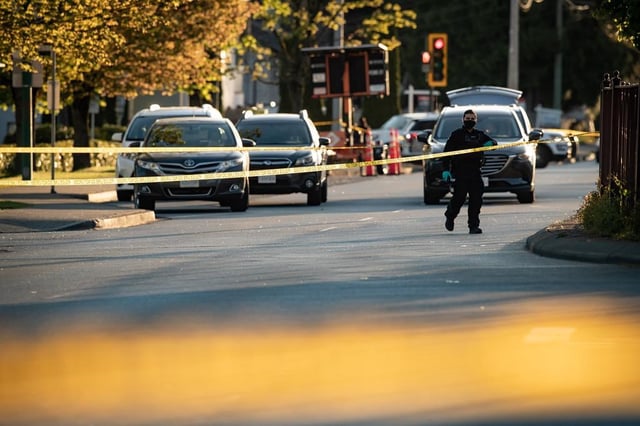 A group of more than 30 British Columbia retailers, trade associations and other groups is calling for a co-ordinated government response to repeat offenders they say are behind a wave of theft, vandalism and violent crime. A police officer works at the scene of a fatal shooting outside a shopping centre, in Delta, B.C., on Saturday, May 1, 2021. 
