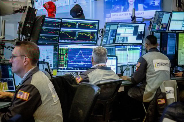 Traders work on the floor of the New York Stock Exchange on June 20, 2025.