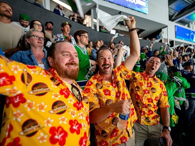 Fans at the Abbotsford Centre cheer during the second period of Game 4 of the AHL Calder Cup Finals between the Abbotsford Canucks and Charlotte Checkers on Thursday.
