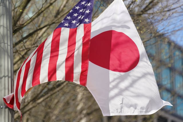 Japanese and U.S. Flags fly side by side outside the White House in Washington, U.S., April 5, 2024.  REUTERS/Kevin Lamarque/File Photo
