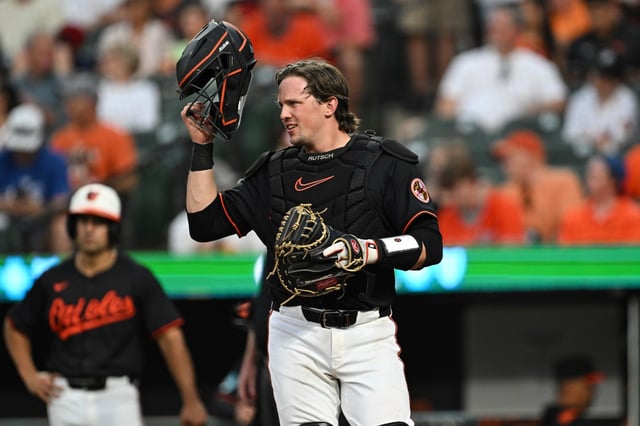 Baltimore Orioles catcher Adley Rutschman putting on his helmet during a baseball game against the Detroit Tigers in Baltimore, Thursday, June 12, 2025. (AP Photo/Terrance Williams)
