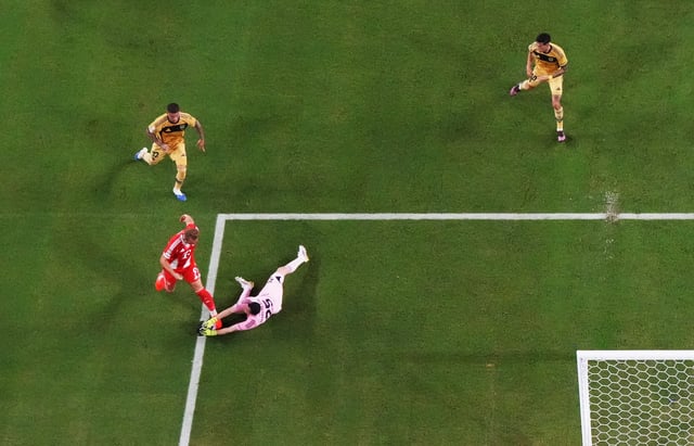 Soccer Football - FIFA Club World Cup - Group C - Bayern Munich v Boca Juniors - Hard Rock Stadium, Miami Gardens, Florida, U.S. - June 20, 2025 Boca Juniors' Agustin Marchesin in action with Bayern Munich's Harry Kane REUTERS/Marco Bello