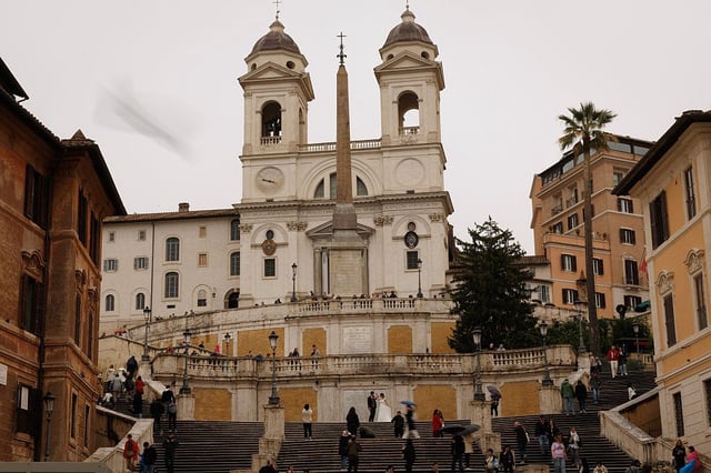 A couple have wedding photos taken on the Spanish Steps on March 27, 2025 in Rome, Italy.