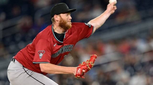 Apr 4, 2025; Washington, District of Columbia, USA; Arizona Diamondbacks pitcher A.J. Puk (33) throws a pitch during the eighth inning against the Washington Nationals at Nationals Park. Mandatory Credit: Reggie Hildred-Imagn Images