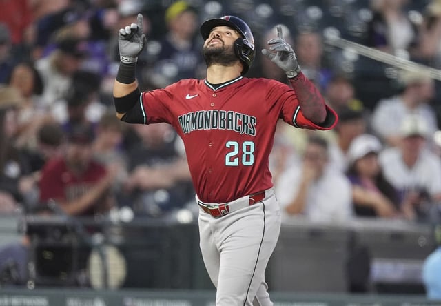 Arizona Diamondbacks' Eugenio Suárez gestures as he heads down the third base line after hitting a two-run home run off Colorado Rockies relief pitcher Ryan Rolison in the sixth inning of a baseball game Friday, June 20, 2025, in Denver. (AP Photo/David Zalubowski)