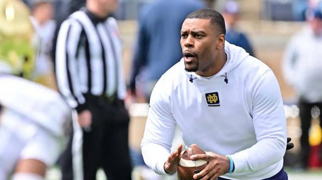 Apr 20, 2024; Notre Dame, IN, USA; Notre Dame Fighting Irish defensive backs coach Mike Mickens participates in warmups before the Blue-Gold Game at Notre Dame Stadium. Mandatory Credit: Matt Cashore-Imagn Images
