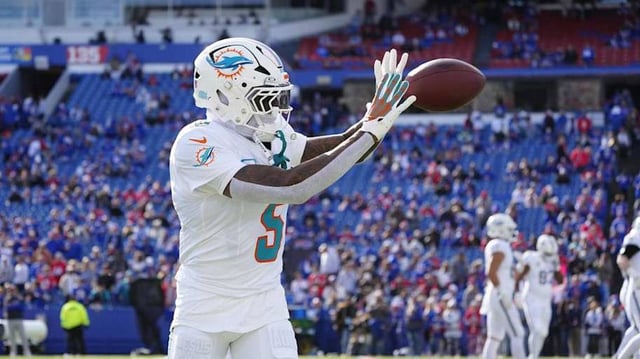Nov 3, 2024; Orchard Park, New York, USA; Miami Dolphins cornerback Jalen Ramsey (5) warms up prior to the game against the Buffalo Bills at Highmark Stadium. Mandatory Credit: Gregory Fisher-Imagn Images