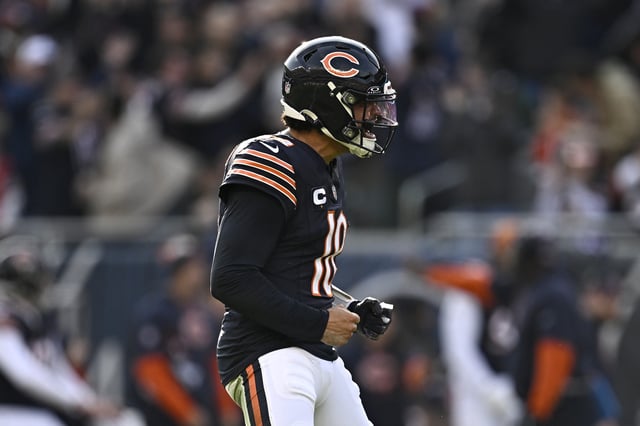 Caleb Williams #18 of the Chicago Bears celebrates after his team&#39;s rushing touchdown in the third quarter of a game against the Green Bay Packers at Soldier Field on November 17, 2024 in Chicago, Illinois.