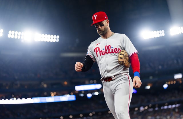 TORONTO, ON - JUNE 4: Bryce Harper #3 of the Philadelphia Phillies walks to the dugout in a break in play against the Toronto Blue Jays in their MLB game at the Rogers Centre on June 4, 2025 in Toronto, Ontario, Canada.