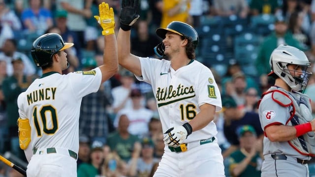 Jun 20, 2025; West Sacramento, California, USA; Athletics first baseman Nick Kurtz (16) celebrates with third baseman Max Muncy (10) after hitting a two run home run during the first inning against the Cleveland Guardians at Sutter Health Park. Mandatory Credit: Sergio Estrada-Imagn Images