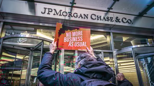 A participant at a protest by a coalition of environmental groups led by Third Act NYC in February 2023.