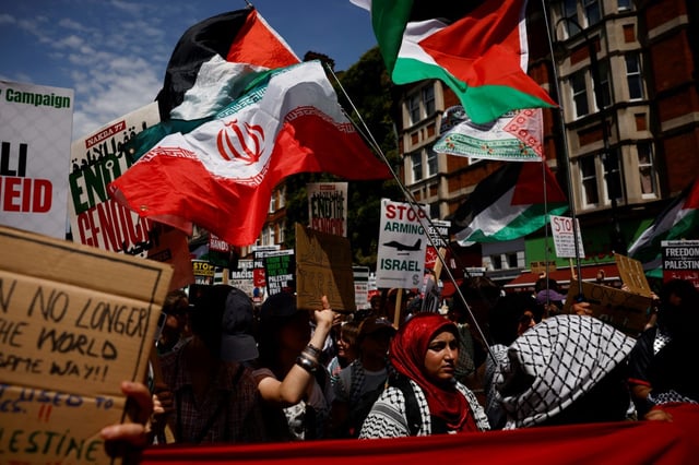 The march comes amid heightened global tensions as the United States mulls joining Israel's strikes against Iran