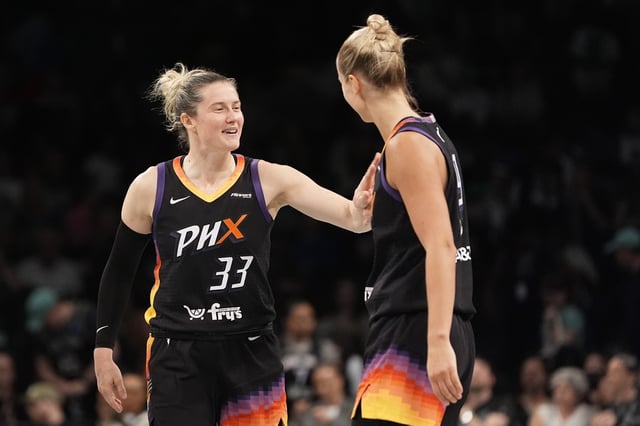 Sami Whitcomb #33 and Kitija Laksa #9 of the Phoenix Mercury react after defeating the New York Liberty 89-81 at Barclays Center on June 19, 2025 in New York City.