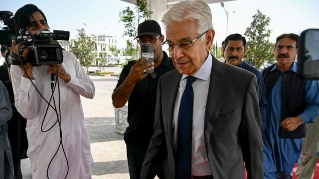 Pakistan's defence minister Khawaja Muhammad Asif (C) arrives at the Parliament House in Islamabad.
