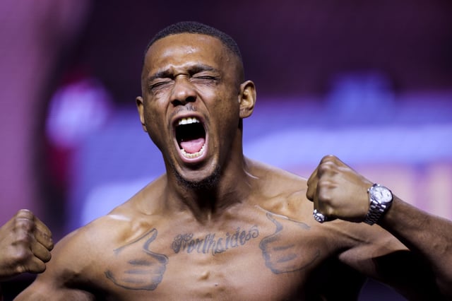 Jamahal Hill stands on the scale during the UFC 300 ceremonial weigh-in at MGM Grand Garden Arena on April 12, 2024 in Las Vegas, Nevada.
