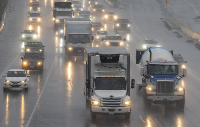 Traffic moves along highway 1 as heavy rains form an atmospheric river continue in Burnaby, B.C., Tuesday, November 30, 2021.  THE CANADIAN PRESS/Jonathan Hayward
