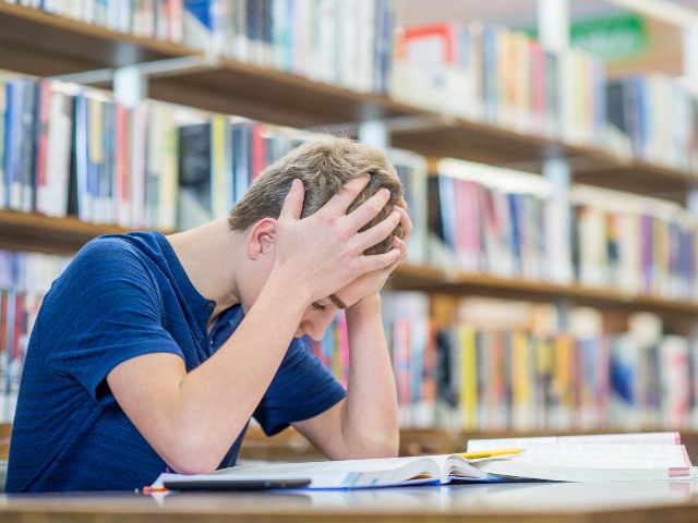 Student struggling in library