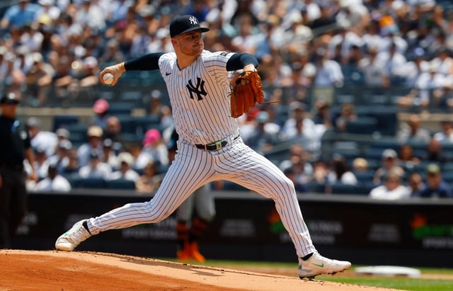 New York Yankees pitcher Clarke Schmidt throws during the first inning of a baseball game against the Baltimore Orioles, Saturday, June 21, 2025, in New York. (AP Photo/Noah K. Murray)