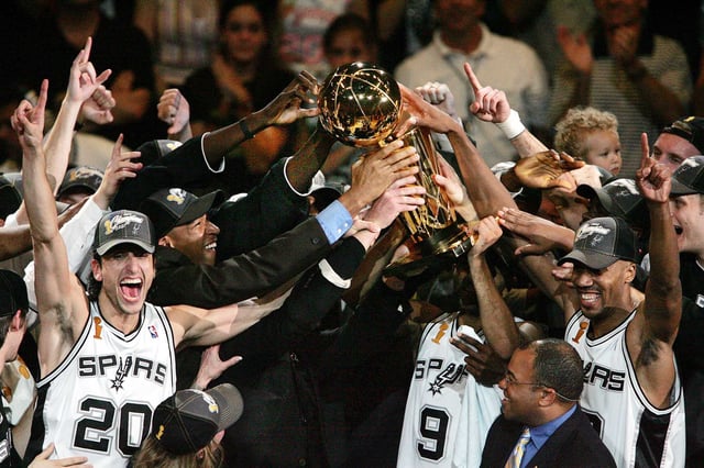 San Antonio Spurs&#39; Manu Ginobili, left, Tony Parker (9) and Bruce Bowen, right, celebrate with the NBA Championship trophy after they defeated the Detroit Pistons 81-74 to win the NBA finals in San Antonio, Thursday, June 23, 2005. History often remembers Game 7s as a matter of destiny, but that ignores the fight it takes to win an NBA title. (AP Photo/M. Spencer Green)