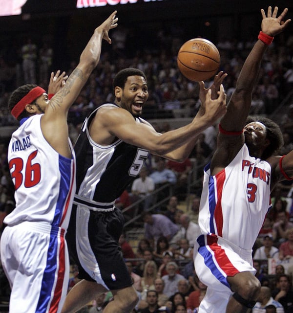 San Antonio Spurs&#39; Robert Horry (5) loses the ball as he charges the basket against Detroit Pistons Rasheed Wallace (36), and Ben Wallace (3) during the first quarter in Game 3 of the NBA Finals in Auburn Hills, Mich., Tuesday, June 14, 2005. History often remembers Game 7s as a matter of destiny, but that ignores the fight it takes to win an NBA title. (AP Photos/Jeff Roberson)
