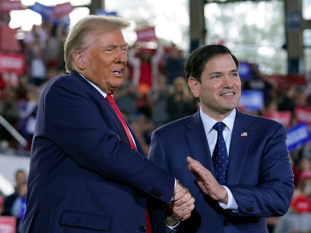 Republican presidential nominee former President Donald Trump greets Sen. Marco Rubio, R-Fla., as Arkansas Gov. Sarah Huckabee Sanders looks on, during a campaign rally at J.S. Dorton Arena, Monday, Nov. 4, 2024, in Raleigh, N.C. (Evan Vucci/AP)
