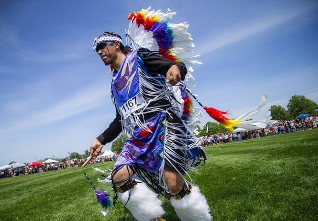  Dancers took part in the Grand Entry to begin the powwow Saturday afternoon under the hot sun, their regalia dancing in the wind and shimmering with vibrant, stunning colours.