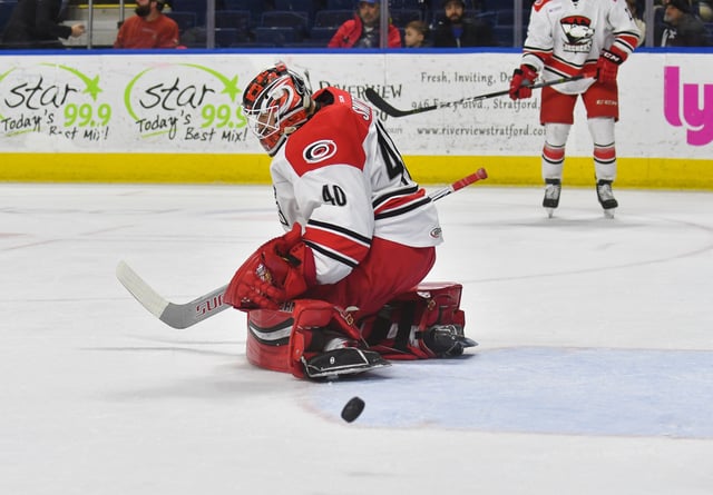 Jeremy Smith #40 of the Charlotte Checkers deflects a shot during a game against the Bridgeport Sound Tigers at the Webster Bank Arena on February 25, 2018 in Bridgeport, Connecticut.