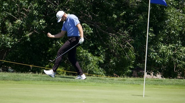 Myles Creighton celebrates after chipping on his final hole of Saturday’s round to shoot an 11-under-par 59, which tied the Wichita Open tournament record.