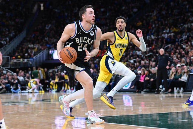 Apr 27, 2025; Milwaukee, Wisconsin, USA; Milwaukee Bucks guard Pat Connaughton (24) drives for the basket against Indiana Pacers guard Tyrese Haliburton (0) in the fourth quarter during game four of first round for the 2024 NBA Playoffs at Fiserv Forum. Mandatory Credit: Benny Sieu-Imagn Images/File Photo