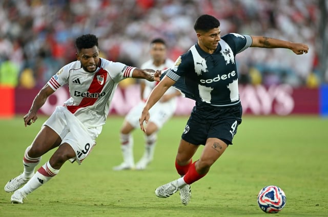 River Plate's Colombian forward Miguel Borja and Monterrey's Victor Guzman battle for possession in their Club World Cup stalemate
