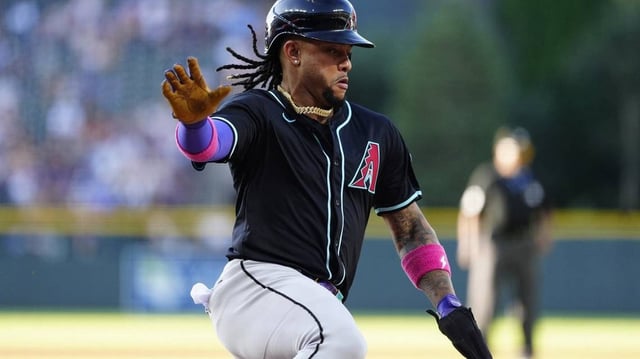 Jun 21, 2025; Denver, Colorado, USA; Arizona Diamondbacks second baseman Ketel Marte (4) scores a run in in the first inning against the Colorado Rockies at Coors Field. Mandatory Credit: Ron Chenoy-Imagn Images