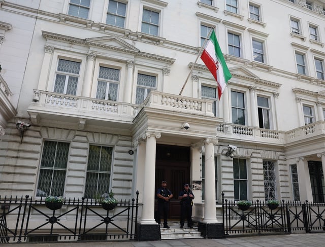 Police officers stand in front of Iran's embassy, after six men were arrested earlier on the same day on suspicion of grievous bodily harm during a protest, London, Britain, June 20, 2025. REUTERS/Isabel Infantes/File Photo