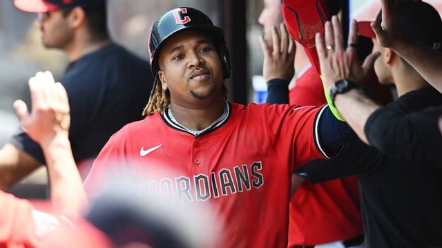 Jun 11, 2025; Cleveland, Ohio, USA; Cleveland Guardians third baseman Jose Ramirez (11) celebrates after scoring on a grand slam by Cleveland Guardians first baseman Carlos Santana (not pictured) during the third inning against the Cincinnati Reds at Progressive Field. Mandatory Credit: Ken Blaze-Imagn Images