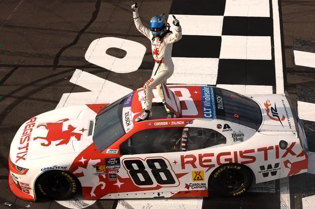 Connor Zilisch, driver of the #88 Registix Chevrolet, celebrates after winning the NASCAR Xfinity Series Explore the Pocono Mountains 250 at Pocono Raceway on June 21, 2025 in Long Pond, Pennsylvania.